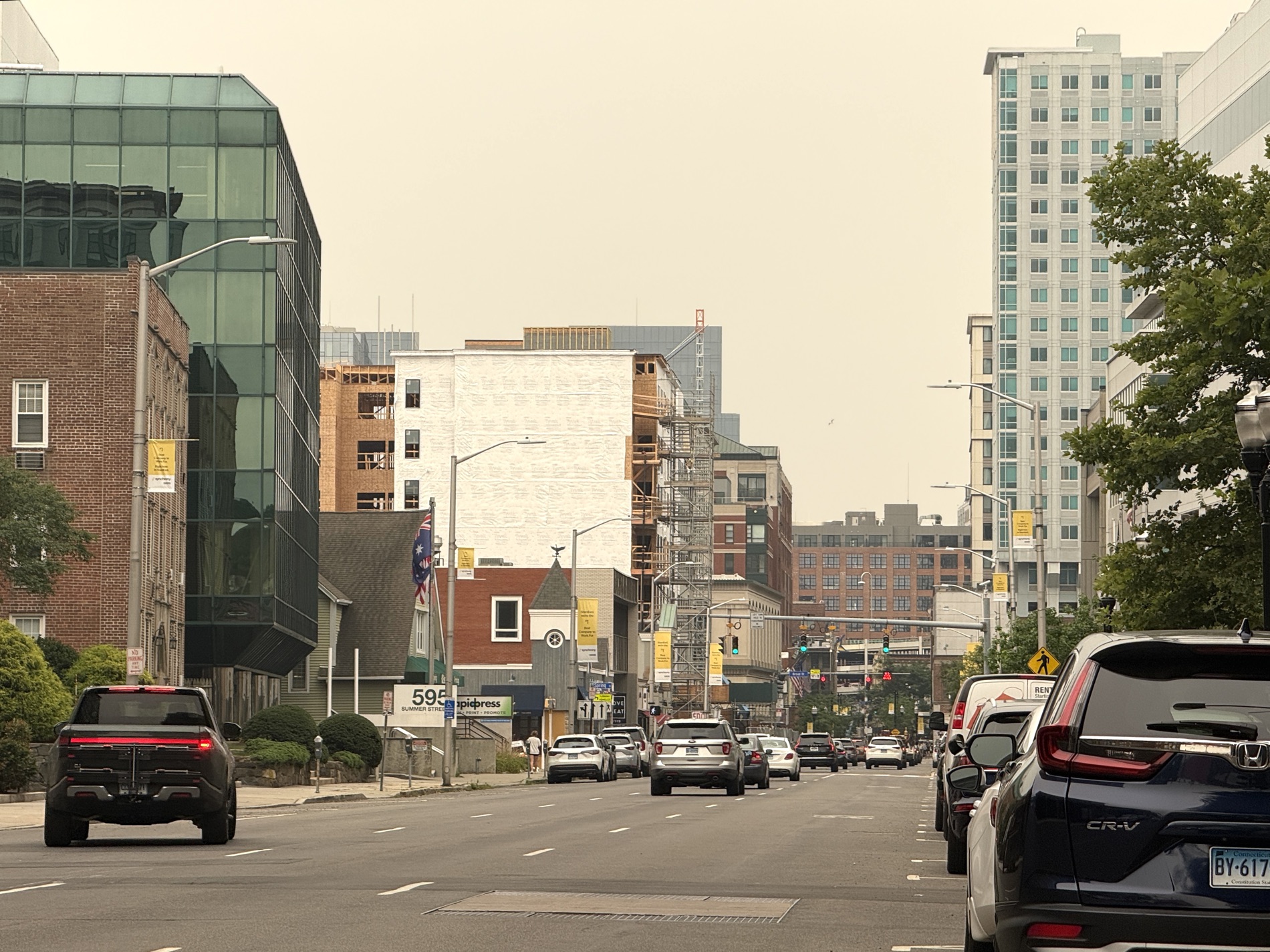 Stamford real estate agent near me — Summer Street, Downtown Stamford Summer Street in downtown Stamford, CT — new apartment construction rising over tree-lined blocks; the streets your local Stamford real estate agent near me, John Restrepo, works every day